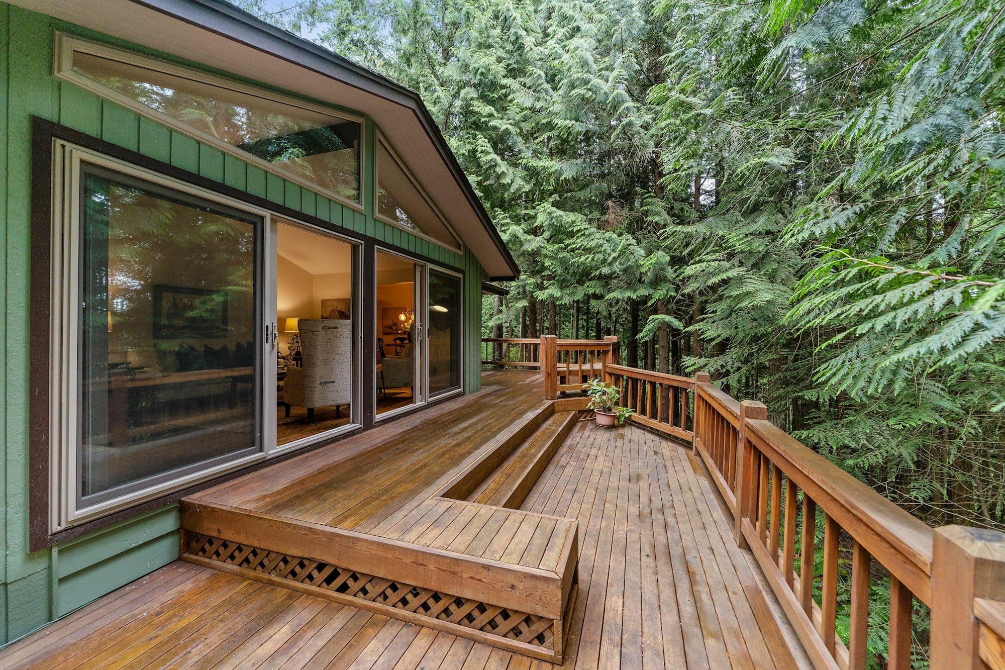 Cedar deck with built-in benches glowing at evening