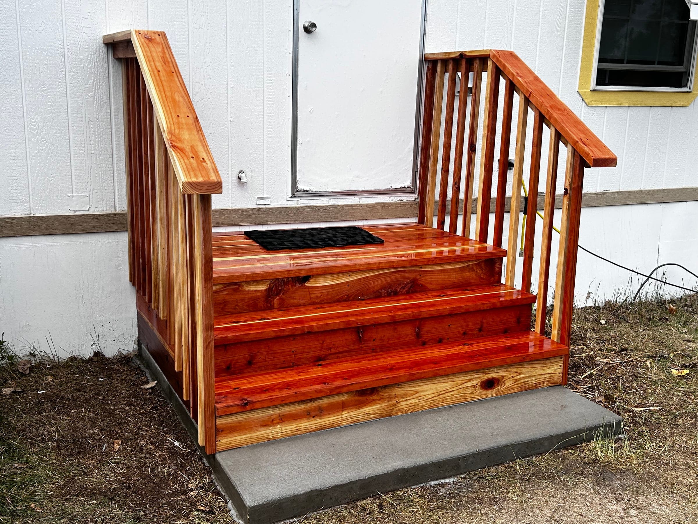 Redwood entry stairs and railings, freshly finished