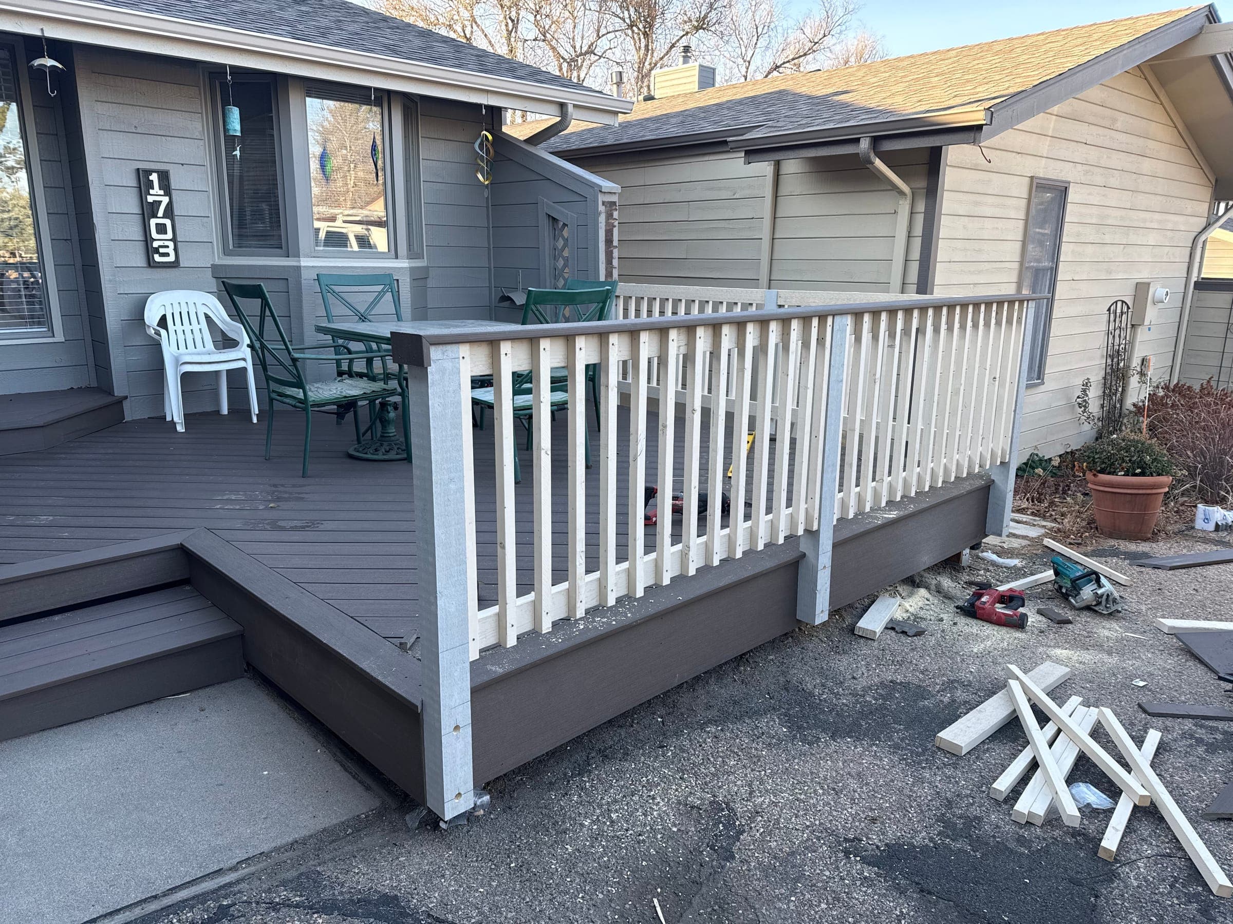 Composite deck with white railing during final construction